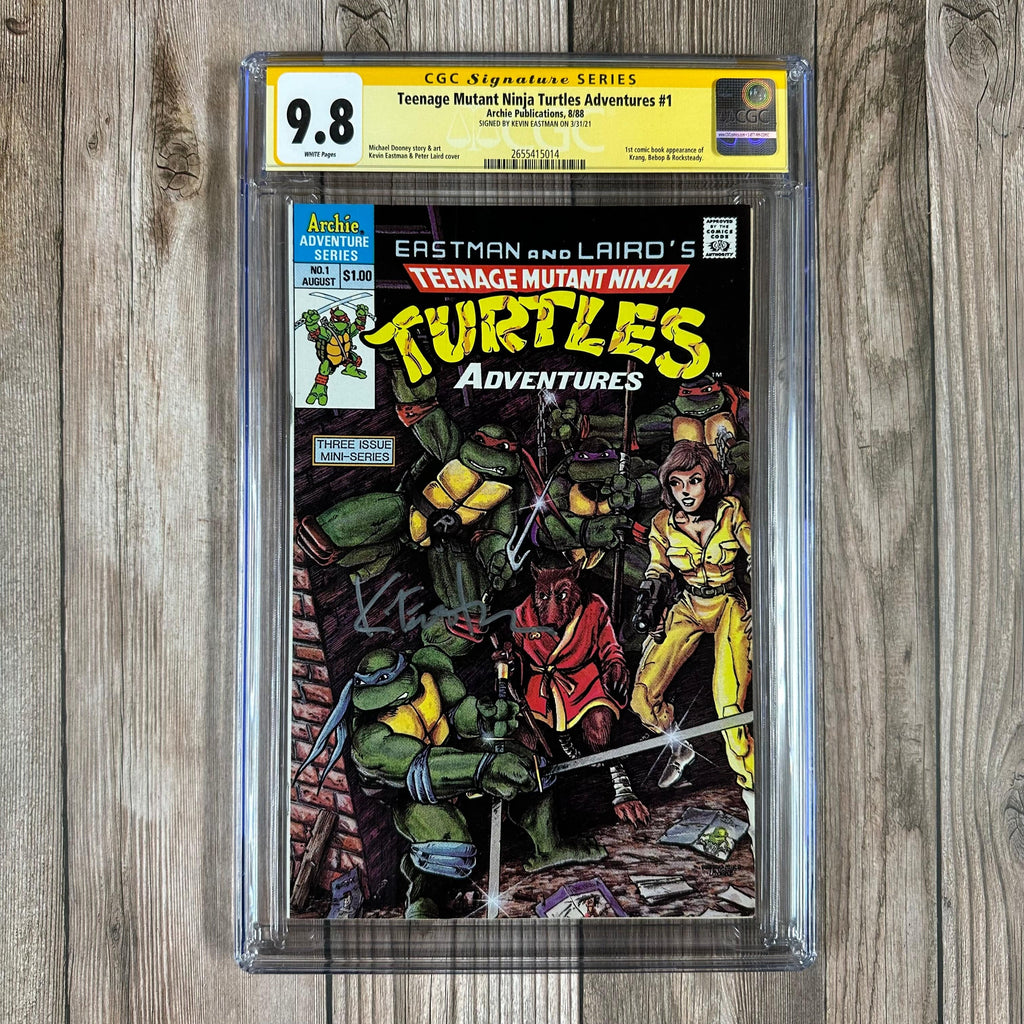 Bry's Comics *B0X2 Teenage Mutant Ninja Turtles Adventures #1 CGC 9.8 WP SS Signed by Kevin Eastman 1st appearance of Krang, 1st cameo appearance of Bebop and Rocksteady (cert:5014)